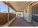 Relaxing enclosed patio with neutral carpet, roll-down shades, and natural light filtering through at 6960 W Peoria Ave # 74, Peoria, AZ 85345