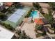 Overhead view of tennis courts and pool in residential neighborhood at 8068 E Del Trigo Rd, Scottsdale, AZ 85258