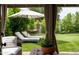 Relaxing backyard retreat with lounge chairs, hammock, and lush greenery at 8068 E Del Trigo Rd, Scottsdale, AZ 85258