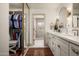 Bathroom features a double sink vanity with white countertops and an adjacent walk-in closet at 8068 E Del Trigo Rd, Scottsdale, AZ 85258