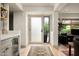Bright hallway with a stylish entrance door, seamlessly connecting the living spaces with a modern design at 8068 E Del Trigo Rd, Scottsdale, AZ 85258
