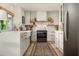 Modern kitchen with stainless steel appliances, white cabinets, and ample counter space, offering a clean design at 8068 E Del Trigo Rd, Scottsdale, AZ 85258