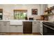 Kitchen features farmhouse sink, stainless steel appliances, stone countertops, and wood accents at 8068 E Del Trigo Rd, Scottsdale, AZ 85258