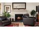 Comfortable living room with a fireplace and cozy seating arrangement, perfect for relaxation at 8068 E Del Trigo Rd, Scottsdale, AZ 85258
