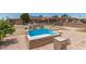 Backyard area with an empty pool surrounded by gravel at 8602 N 41St Ave, Phoenix, AZ 85051