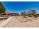 Expansive backyard featuring a large decorative rock area and a quaint stone picnic table set at 8602 N 41St Ave, Phoenix, AZ 85051