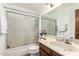 Bathroom featuring a sink, mirror, toilet and shower with sliding glass doors at 8602 N 41St Ave, Phoenix, AZ 85051