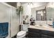 Well-lit bathroom features tiled walls, a shower, and a toilet at 8602 N 41St Ave, Phoenix, AZ 85051