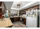 Efficient kitchen design with a white refrigerator, stainless steel oven, and plenty of counter space at 8602 N 41St Ave, Phoenix, AZ 85051