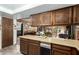 Classic kitchen features wood cabinets, countertop, and view into the living room at 8602 N 41St Ave, Phoenix, AZ 85051