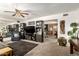 Spacious living room boasts a large TV, built-in shelves, and a comfortable seating area for relaxing at 8602 N 41St Ave, Phoenix, AZ 85051