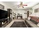 Bright living room with a comfortable sofa, ceiling fan, and stylish decor for cozy relaxation at 8602 N 41St Ave, Phoenix, AZ 85051
