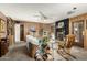Warm living room with wood paneling, a brick fireplace, and comfortable seating arrangement at 8602 N 41St Ave, Phoenix, AZ 85051