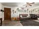 Cozy living room features a plush sofa, a ceiling fan, and natural light, creating an inviting space at 8602 N 41St Ave, Phoenix, AZ 85051