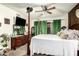 Charming main bedroom showcasing a four poster bed, dresser and view to outside at 8602 N 41St Ave, Phoenix, AZ 85051