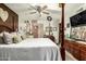 This large main bedroom features a comfortable bed, dresser and decorations at 8602 N 41St Ave, Phoenix, AZ 85051