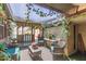 Inviting covered patio with a seating area, perfect for outdoor relaxation and enjoying the backyard at 8602 N 41St Ave, Phoenix, AZ 85051