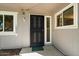 Home exterior featuring a security door and a 'Welcome' mat at 10305 W Campana Dr, Sun City, AZ 85351