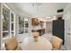 Bright eat-in kitchen with stainless steel appliances, modern lighting, white countertops, and beautiful marble-patterned floors at 10305 W Campana Dr, Sun City, AZ 85351