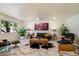 Bright living room featuring modern decor, marble floors, and stylish furniture at 10305 W Campana Dr, Sun City, AZ 85351