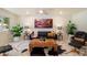 Bright living room featuring modern decor, marble floors, and stylish furniture at 10305 W Campana Dr, Sun City, AZ 85351
