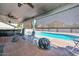 Inviting covered patio and pool area featuring outdoor seating at 10806 W Adam Ave, Peoria, AZ 85373