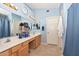 A classic bathroom offers a double vanity, modern light fixtures, and plenty of counter space at 10806 W Adam Ave, Peoria, AZ 85373