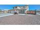 Charming two-story home showcasing a well-maintained gravel yard, solar panels, and an American flag at 10806 W Adam Ave, Peoria, AZ 85373