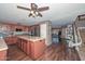 Spacious kitchen featuring an island, dark wood cabinetry, and stainless steel appliances at 10806 W Adam Ave, Peoria, AZ 85373