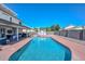 A sparkling pool is the focal point of this backyard oasis, complete with a quaint storage shed and ample patio space at 10806 W Adam Ave, Peoria, AZ 85373