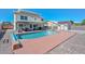 Backyard featuring a refreshing pool with a covered patio, shed, and ample space for outdoor activities at 10806 W Adam Ave, Peoria, AZ 85373