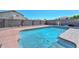 Backyard pool with privacy wall. A pool cover and cleaning robot are visible at 10806 W Adam Ave, Peoria, AZ 85373