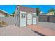 Well maintained storage shed with stone flooring and pathway at 10806 W Adam Ave, Peoria, AZ 85373