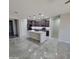 Open concept kitchen with island and modern stainless steel appliances at 1352 W Spine Tree Ave, Queen Creek, AZ 85140