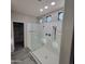 Modern glass enclosed shower with decorative transom windows and a spacious layout at 1352 W Spine Tree Ave, Queen Creek, AZ 85140