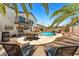 Backyard view featuring a beautiful pool with a grotto, exterior dining, and outdoor TV at 13626 N 89Th St, Scottsdale, AZ 85260