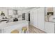Bright kitchen features white cabinets, stainless steel appliances, and marble countertops at 13626 N 89Th St, Scottsdale, AZ 85260