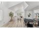 Bright living room with vaulted ceilings, hardwood floors and view into dining area at 13626 N 89Th St, Scottsdale, AZ 85260