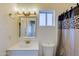 Well-lit bathroom includes a modern vanity, toilet, and a framed mirror at 1409 E Apollo Rd, Phoenix, AZ 85042