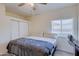 Bedroom featuring fan, closet and window for natural light at 1409 E Apollo Rd, Phoenix, AZ 85042