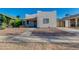 Charming single-story home with neutral stucco, gravel landscaping, and a covered entryway on a clear day at 1409 E Apollo Rd, Phoenix, AZ 85042