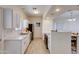 Modern eat-in kitchen includes stainless steel appliances, bar seating and ample counter space at 1409 E Apollo Rd, Phoenix, AZ 85042