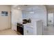 Contemporary kitchen with white cabinets, stainless steel oven and breakfast bar seating at 1409 E Apollo Rd, Phoenix, AZ 85042