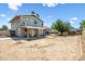View of home's spacious, private backyard, and covered patio with ceiling fans at 15410 N 60Th Ave, Glendale, AZ 85306