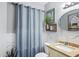 Bathroom featuring vanity with light tan countertop and decorative framed art at 15410 N 60Th Ave, Glendale, AZ 85306