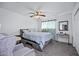 Calming bedroom with light blue accents, ceiling fan and natural light at 15410 N 60Th Ave, Glendale, AZ 85306