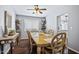 Bright dining room featuring hardwood floors, neutral paint, stylish furnishings and plenty of natural light at 15410 N 60Th Ave, Glendale, AZ 85306