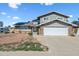 Charming two-story home features a two-car garage, solar panels and a low maintenance front yard at 15410 N 60Th Ave, Glendale, AZ 85306