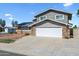 Charming two-story home features a two-car garage and a low maintenance front yard at 15410 N 60Th Ave, Glendale, AZ 85306