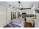 Modern kitchen with a granite island, stainless steel appliances, and ample storage at 15410 N 60Th Ave, Glendale, AZ 85306
